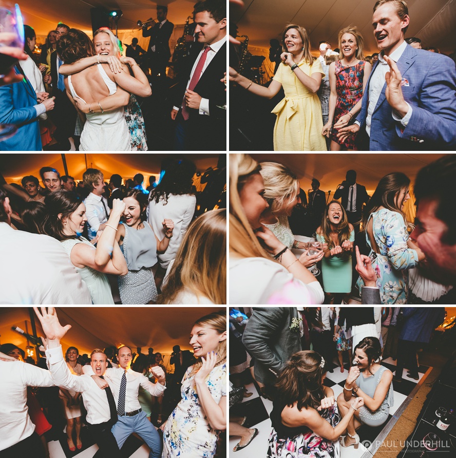 Wedding guests dancing in marquee