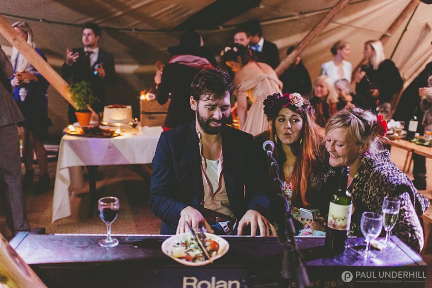 Pianist playing at tipi wedding